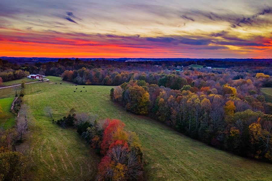 Glasgow, KY - Red Sky and Sunset Over Autumn Forest and Fields Near Glasgow, Kentucky