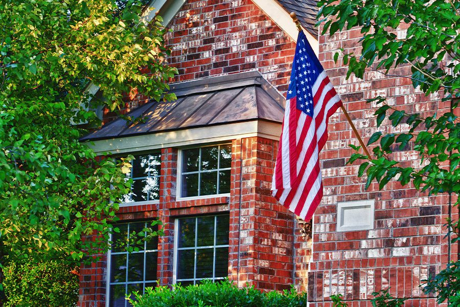 Goodlettsville, TN - Closeup of American Flag Hanging on the Front of a House in Goodlettsville Tennessee
